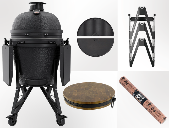 The Bastard kamado - Core Mat graphite complete Large vooraanzicht met daarnaast de upgradebox bestaande uit Half moon cast iron Griddle, essential rack, butcher block en butcher paper